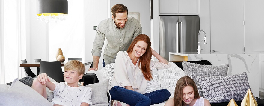 Happy family sitting on a couch